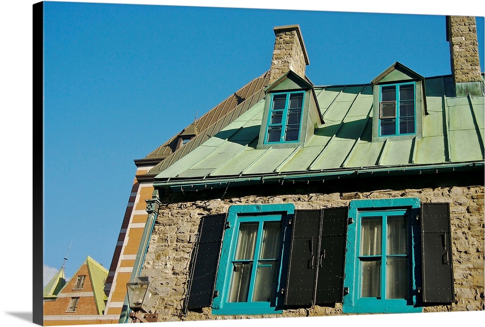 North America, Canada, Quebec, Old Quebec City.  A stone home's upper windows and copper roof