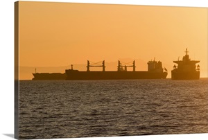 Cargo ship silhouettes in English Bay Beach, Vancouver, Canada image thumbnail
