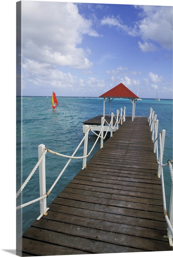 Caribbean, Guadeloupe. Colorful dock and crystal blue water