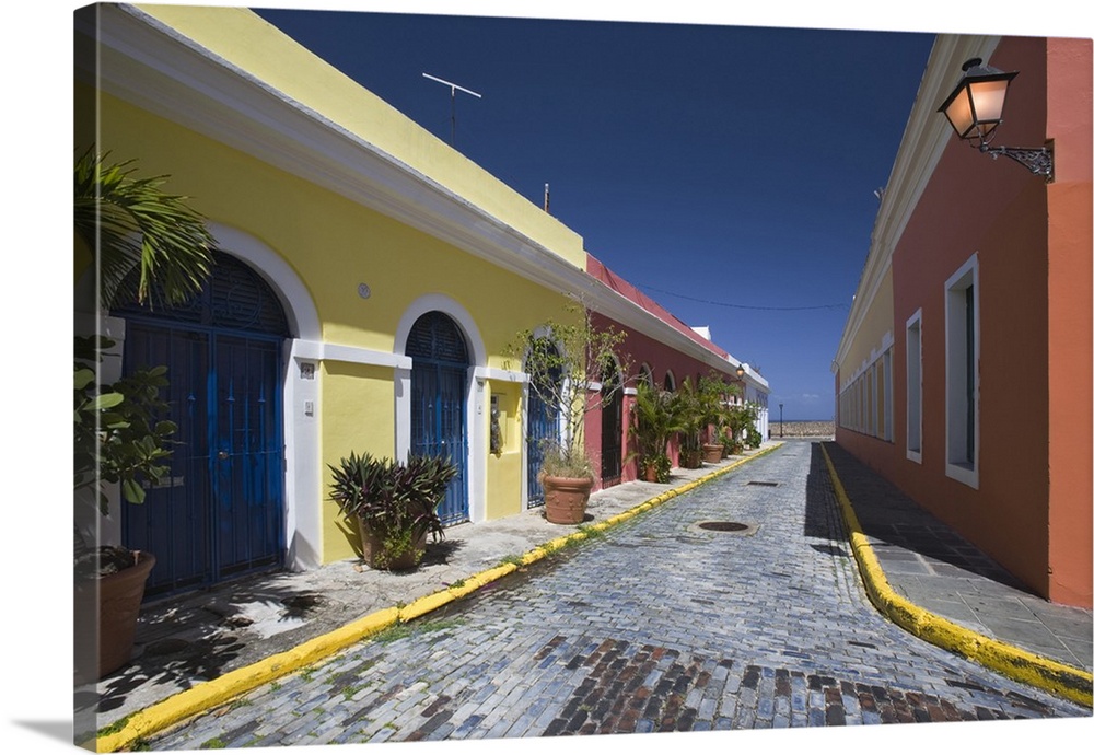 Caribbean, Puerto Rico, Old San Juan. Colorful houses on a cobblestone street. Credit as: Dennis Flaherty / Jaynes Gallery...