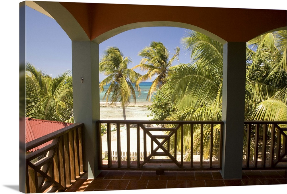 Caribbean, Puerto Rico, Vieques.  Caribbean, beach and palm trees, viewed from porch of house/hotel.  PR