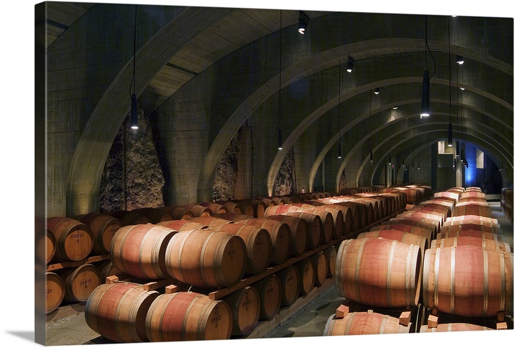 Concrete Roman arches support the ceiling in the cave barrel cellar of Mission Hill Family Estate Winery in Kelona, BC, Ok...
