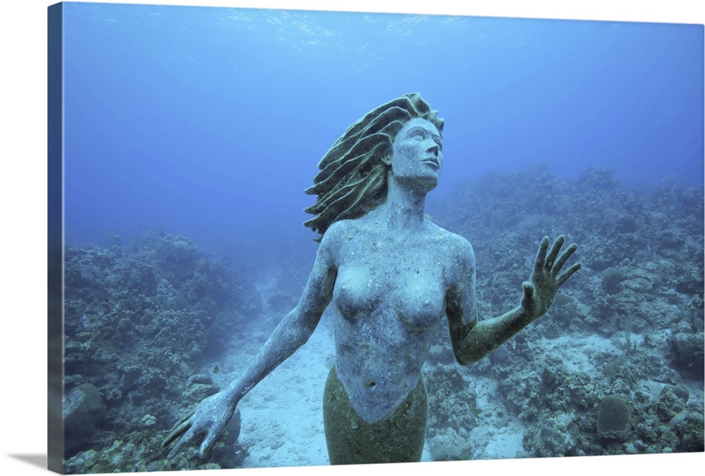 Cayman Islands, Grand Cayman Island, Underwater view mermaid sculpture in shallow coral reefs in Caribbean Sea