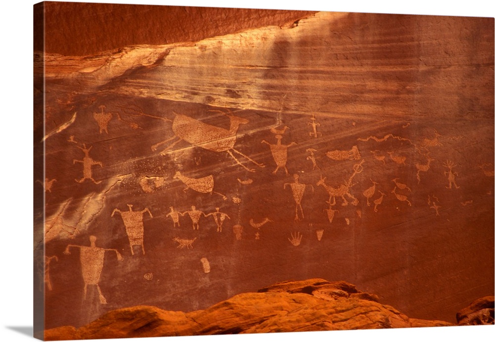 Arizona, Chinle, Canyon de Chelly National Monument. Close view of Anasazi petroglyphs (shaped like people, animals, birds...