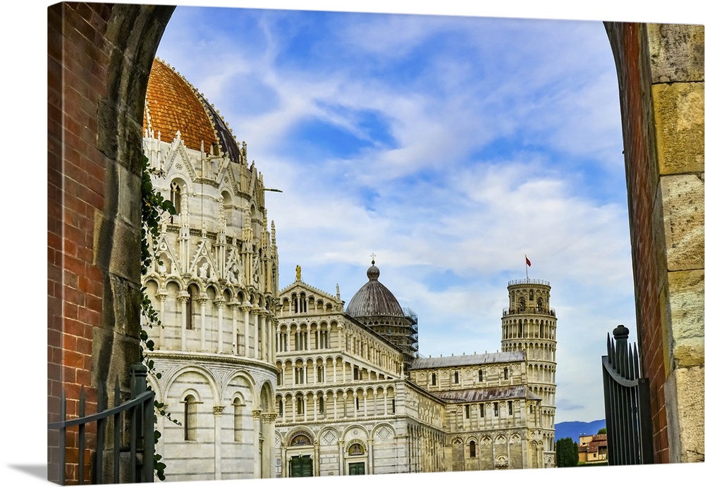 City gate of Piazza del Miracoli with Leaning Tower of Pisa and Pisa Baptistery of St. John, Tuscany Italy. Completed in 1...