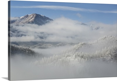 Colorado. Clouds in valleys below Pikes Peak, frosty winter morning