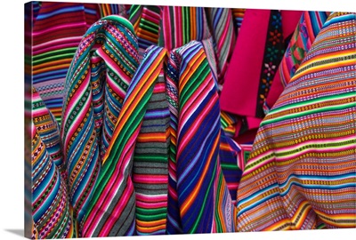 Colorful blankets on display at market, Huaraz, Peru