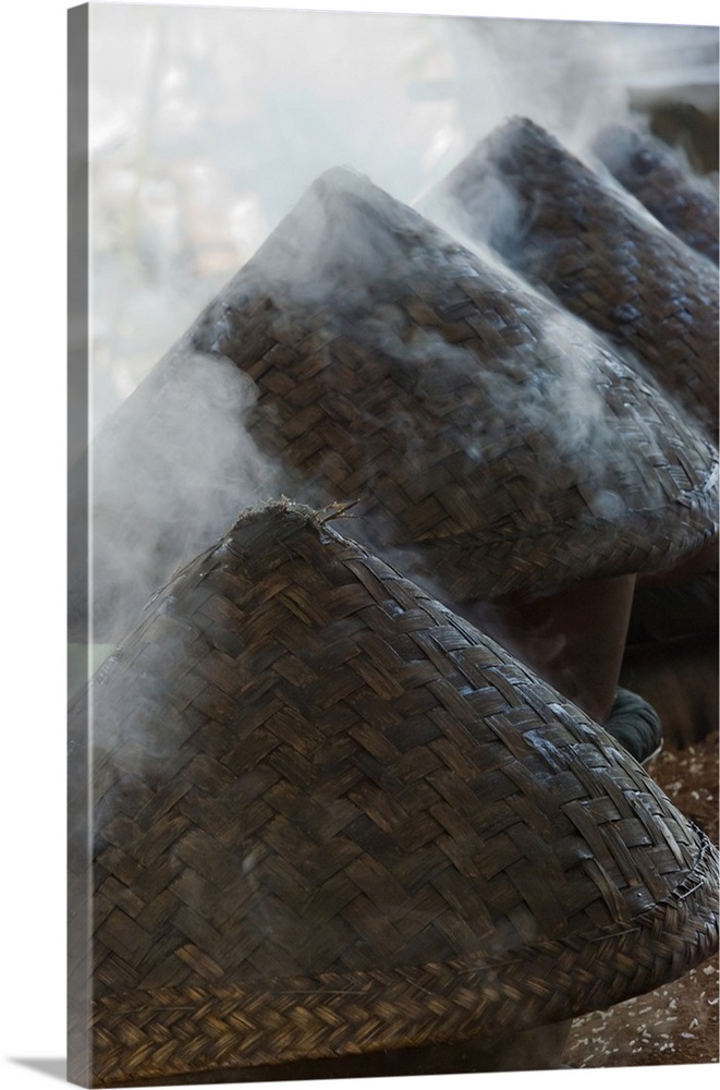 Cooking rice in bamboo woks, Inle Lake, Shan State, Myanmar.