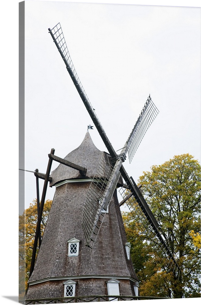 Copenhagen, Denmark - A historic old style windmill after having been restored. Vertical shot.
