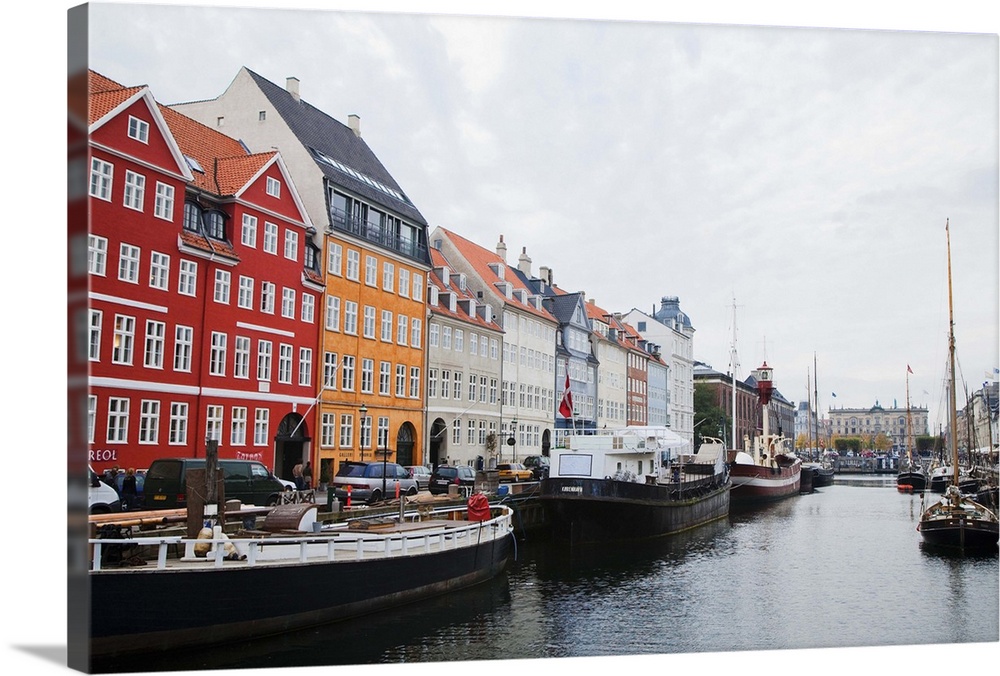 Copenhagen, Denmark - On old world, waterfront city. Boats are viewable on the water. Horizontal shot.