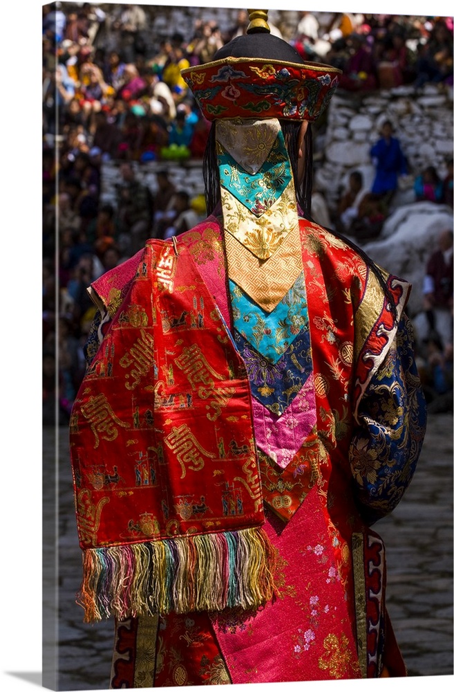 Costumed dancers at religious festivity with many visitors, Paro Tsechu, Bhutan.
