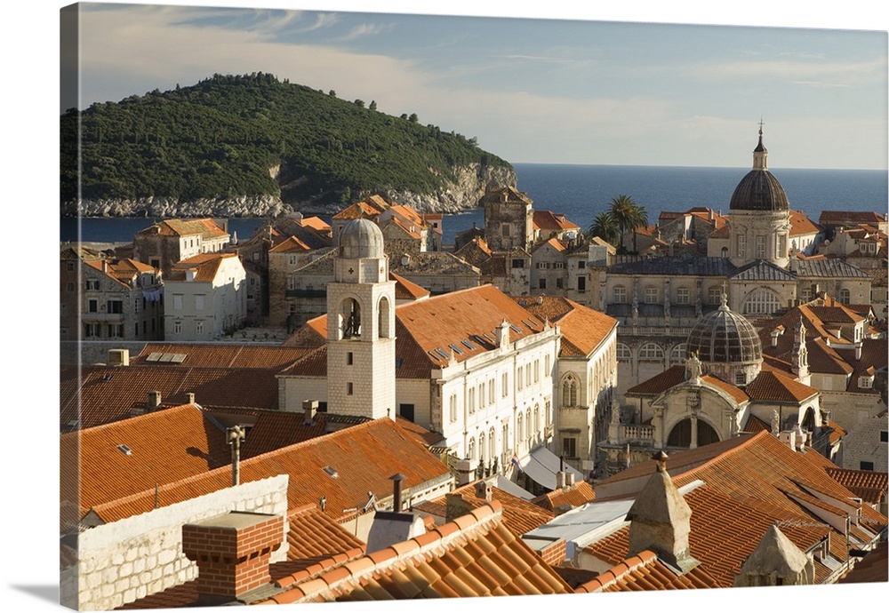 Europe, Croatia, Dalmatia, Dubrovnik.  Red tile roofs dominate the old city of Dubrovnik, viewed from city walls.  Adriati...