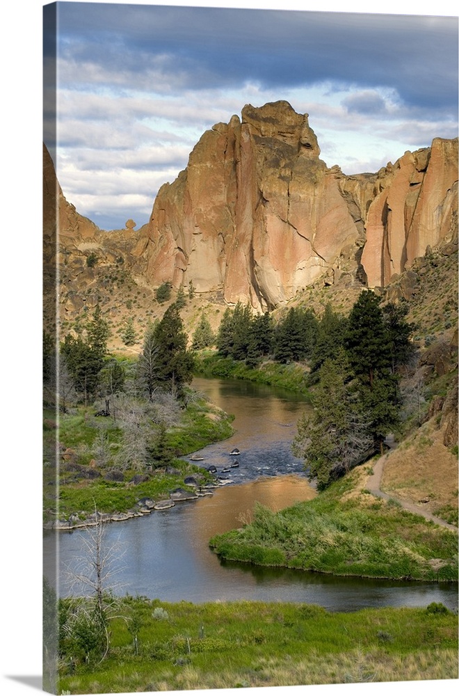 USA, Oregon, Smith Rocks State Park. The subtle colors of the rock faces reflect in the Crooked River at Smith Rocks State...