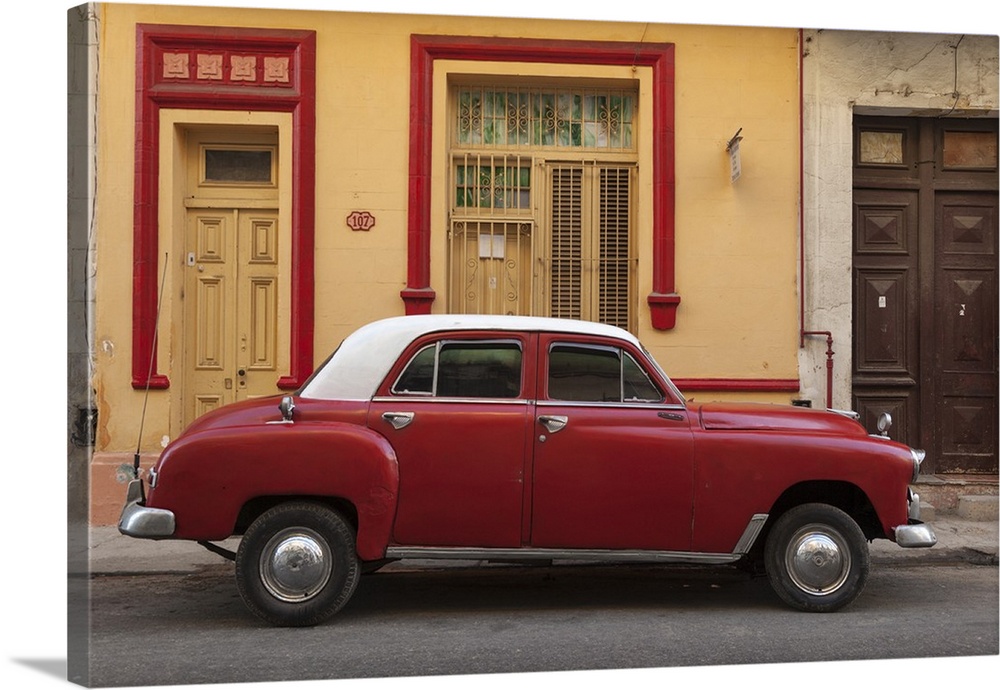 Cuba, Havana. Classic car parked on the street.