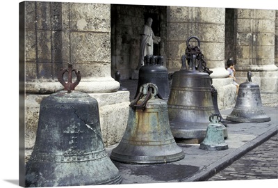 Cuba, Old Havana. Historic bells in Plaza de las Armas