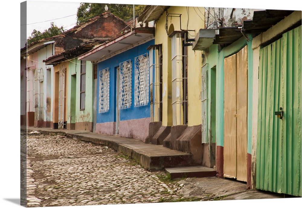 Cuba, Trinidad. Street lined with buildings in the Spanish colonial architectural style.
