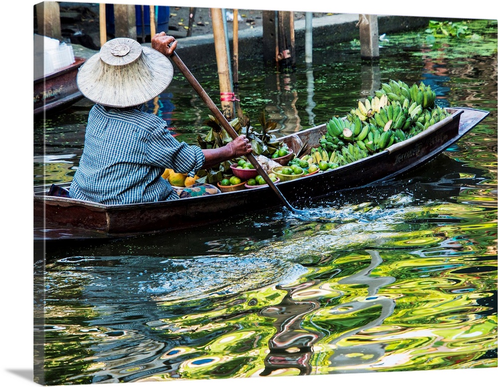 Damnoen Saduak Floating Market with Vendor in Thailand.