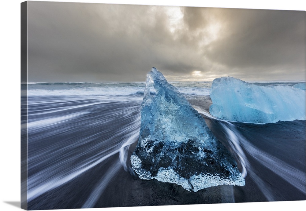Diamond ice chards from calving icebergs on black sand beach at Jokulsarlon in south Iceland.