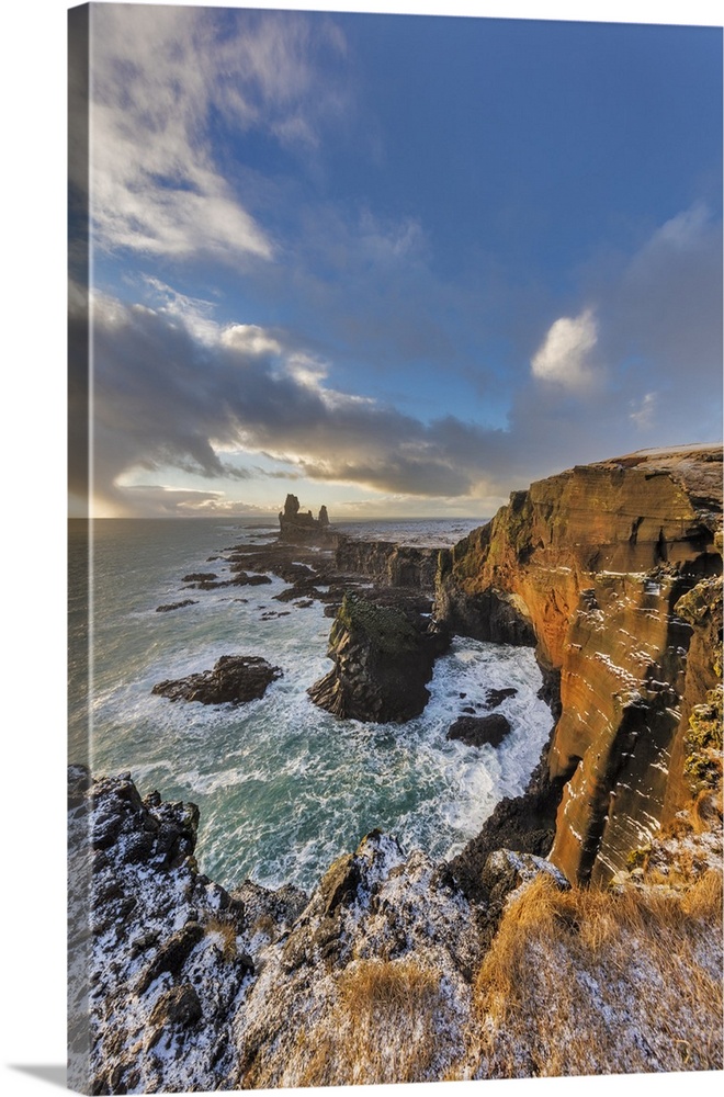 Dramatic cliffs at Londrangar sea stacks in the North Atlantic ocean on the Snaefellsnes peninsula in western Iceland.