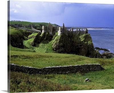 Dunluce Castle rises from the emerald hills on Northern Ireland's Antrim Coast