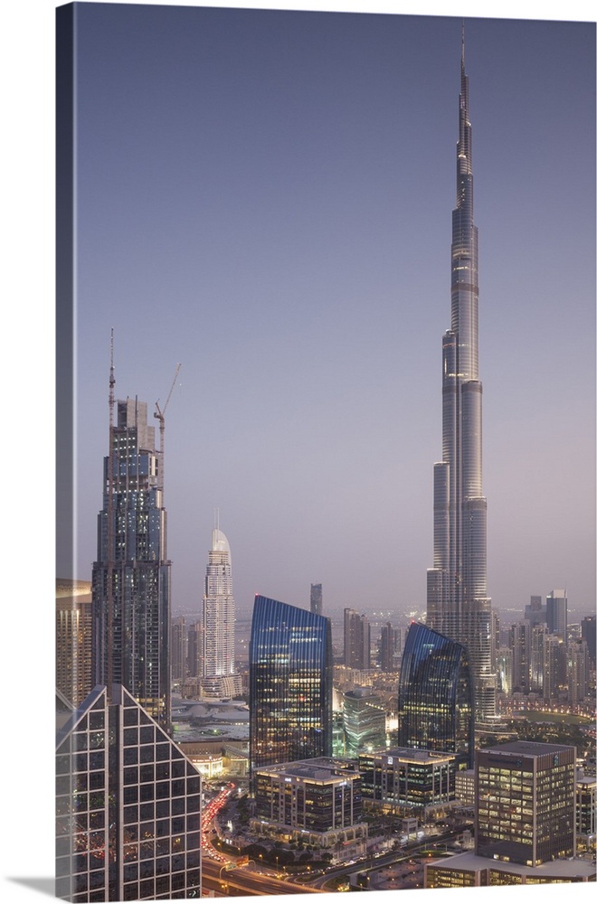 UAE, Dubai, Downtown Dubai, elevated view over Sheikh Zayed Road and Burj Khalifa Tower, world's tallest building, 2016, dusk