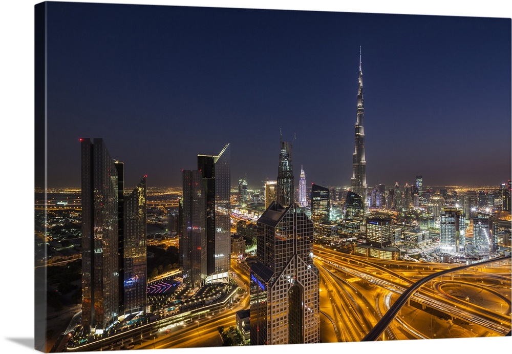 UAE, Dubai, Downtown Dubai, eleavted view over Sheikh Zayed Road and Burj Khalifa Tower, world's tallest building, 2016, dusk