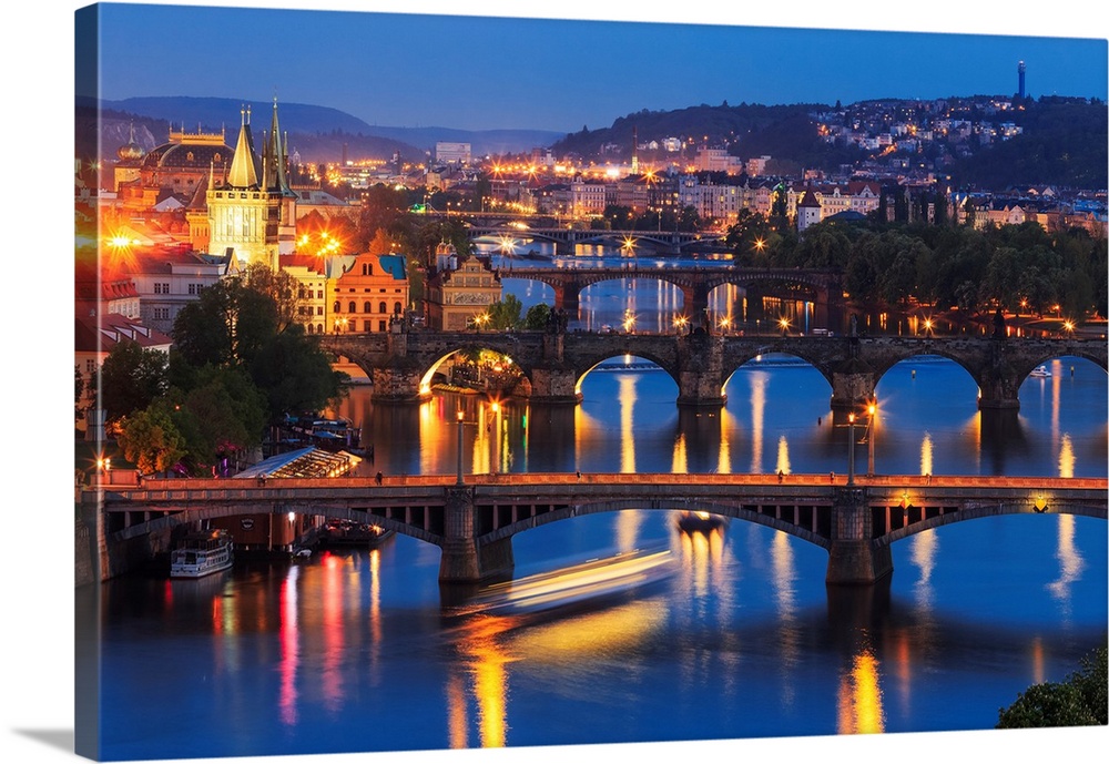 Europe, Czech Republic, Prague. Sunset on city and river bridges. Credit: Jim Nilsen
