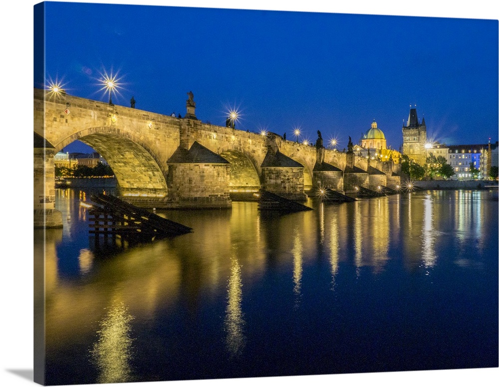 Europe, Czech Republic, Prague.  Charles bridge water reflection at night.