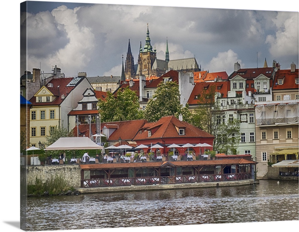Europe, Czech Republic, Prague. Restaurant along the Vltava River from a riverboat.