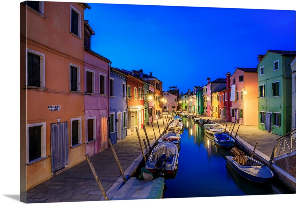 Europe, Italy, Burano. Colorful houses on canal at sunset. Credit: Jim Nilsen