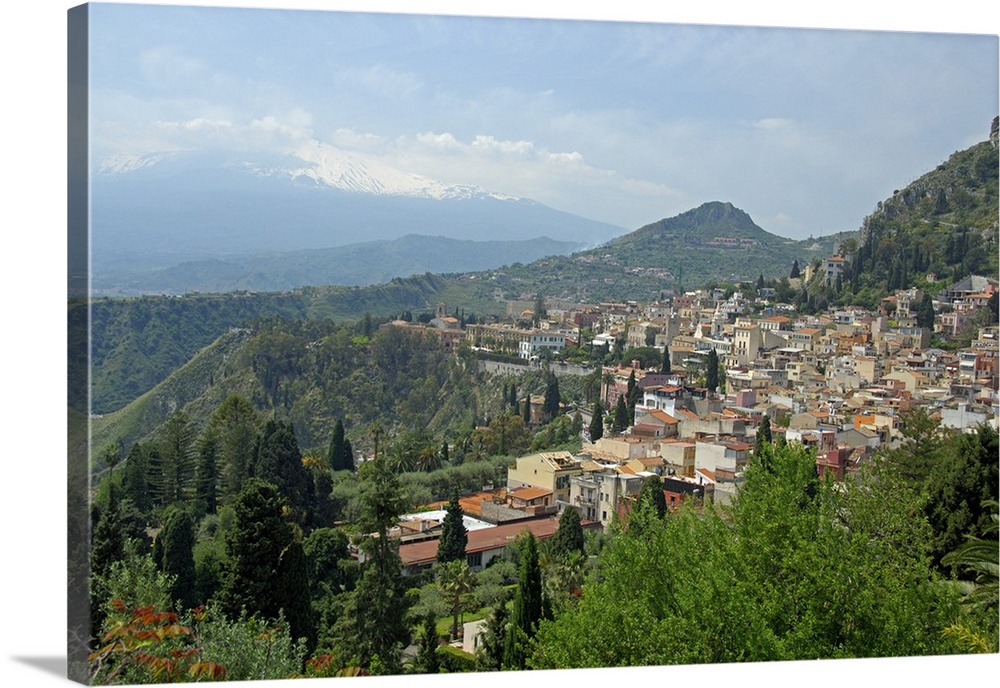 Europe, Italy, Sicily, Taormina. Overview of Taromina, Mt. Etna in distance.