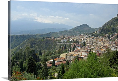 Europe, Italy, Sicily, Taormina. Overview of Taromina, Mt. Etna in distance