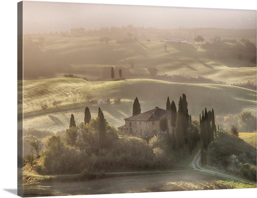 Europe, Italy, Tuscany, Morning light filters through the fog at Belvedere House.