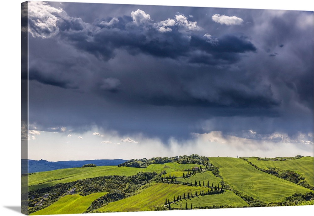 Europe, Italy, Val d' Orcia. Storm clouds over Tuscany landscape. Credit: Jim Nilsen
