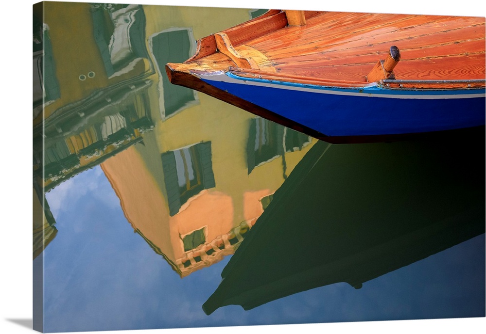 Europe, Italy, Venice. Gondola and building reflect in canal. Credit: Jim Nilsen