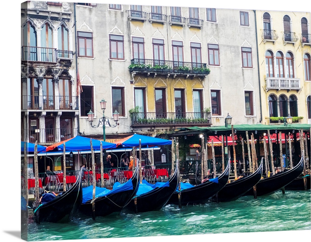 Europe, Italy, Venice, Buildings along the Grand Canal with Gondolas parked.
