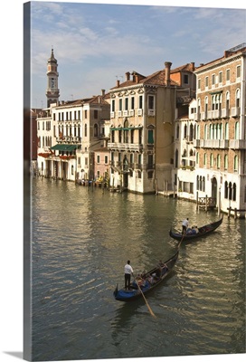 Europe, Italy, Venice. Tourists enjoy a gondola ride along the Grand Canal in Venice