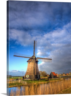 Europe, Netherlands, Nord Holland, Windmill Along Canal Of Nord Holland