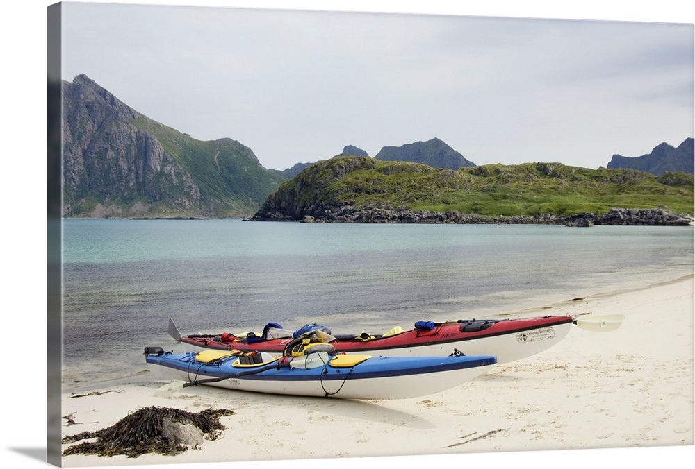 Europe, Norway, Vesteralen. Sea kayaks on beach at Hovden.