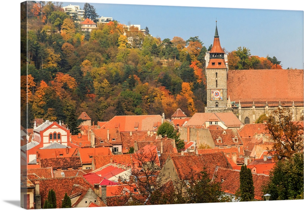 Europe, Romania, Brasov. Poarta Schei district. Olimpia Restaurant near George Street. Clock Tower, spires.