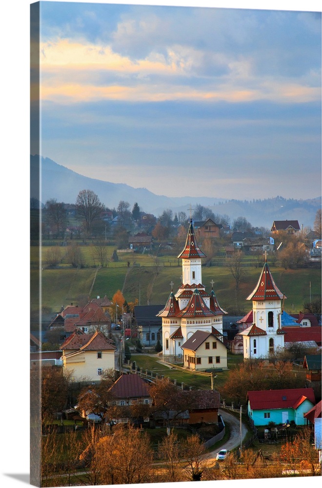 Europe, Romania, Bucovina, Campulung Moldovenesc, Fall colors. Churches in valley.