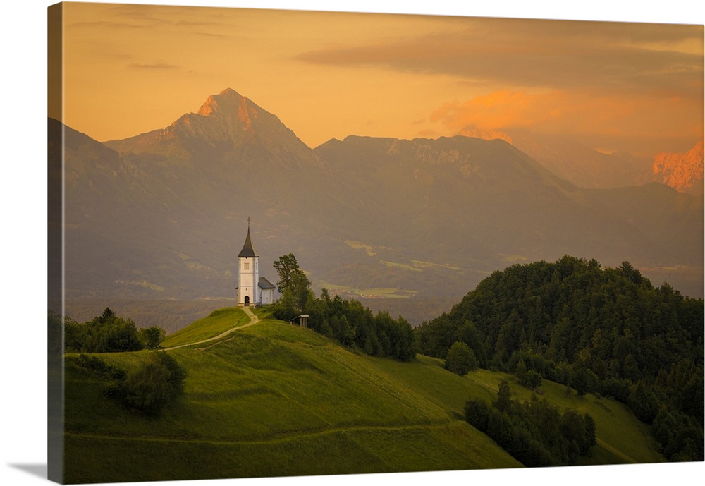 Europe, Slovenia. Chapel of St. Primoz at sunset. Credit: Jim Nilsen / Jaynes Gallery