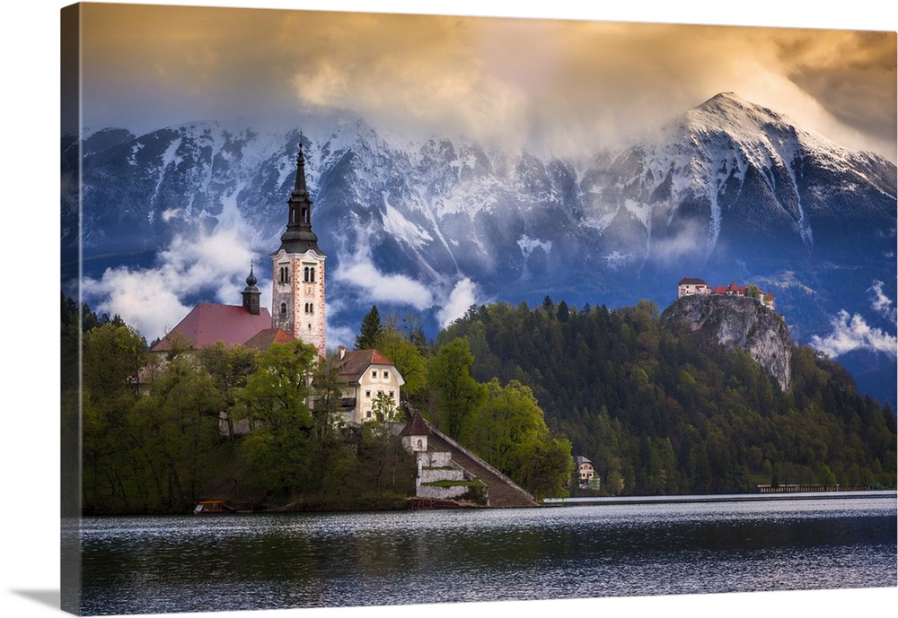 Europe, Slovenia, Lake Bled. Church castle on lake island and mountain landscape. Credit: Jim Nilsen / Jaynes Gallery