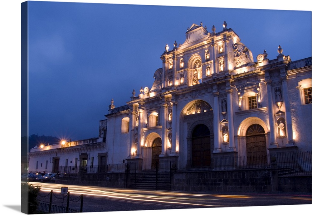 Night photo of famous Cathedral de Santiago with twilight and streaks of traffic in the tourism town of Antigua, Guatemala