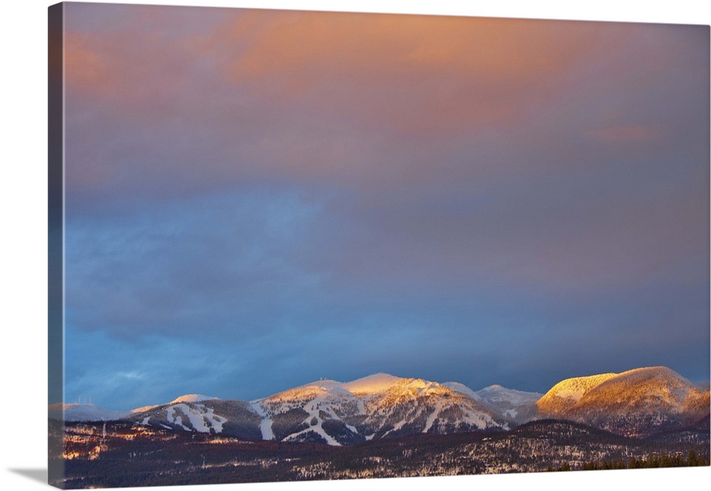 Dusk evening light strikes Big mountain aka Whitefish Mountain Resort in Whitefish Montana