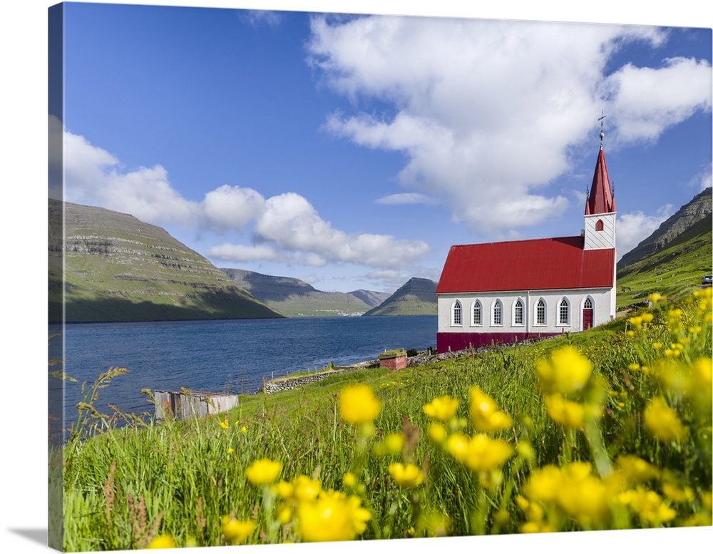 The church in village Husar on Kalsoy, in the background the island of Bordoy and Klaksvik. Nordoyggjar (Northern Isles) i...