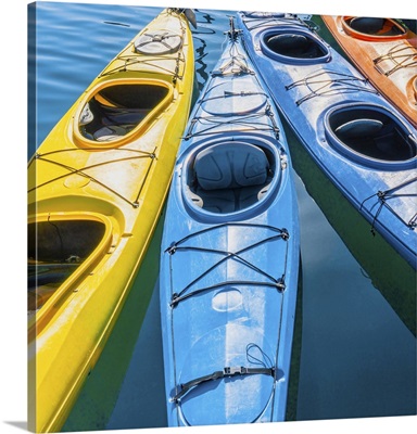 Four Colorful Kayaks Positioned In An Array