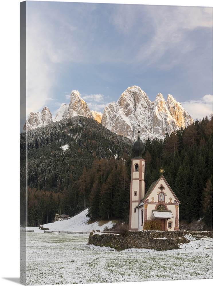 The peaks of Geisler mountain range. The church Sankt Johann in Ranui. Puez-Geisler, Italy, Tyrol.