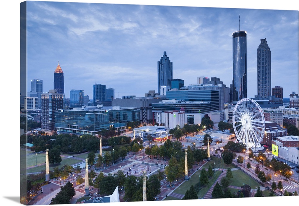 Georgia, Atlanta, Centennial Olympic Park, elevated city view with Ferris wheel, dusk.