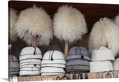 Georgia, Mtskheta, Collection of traditional hats for sale as souvenirs